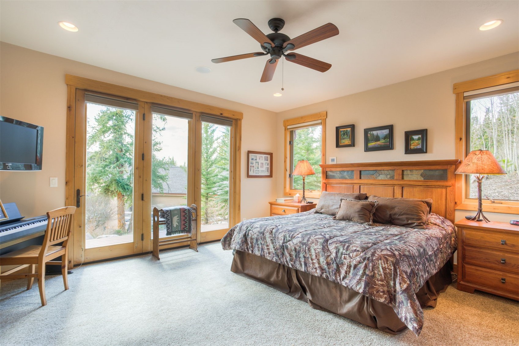 727 Willowbrook Road Silverthorne, CO 80498 - Photo 25 of 47 Bedroom featuring access to outside, light colored carpet, ceiling fan, and recessed lighting