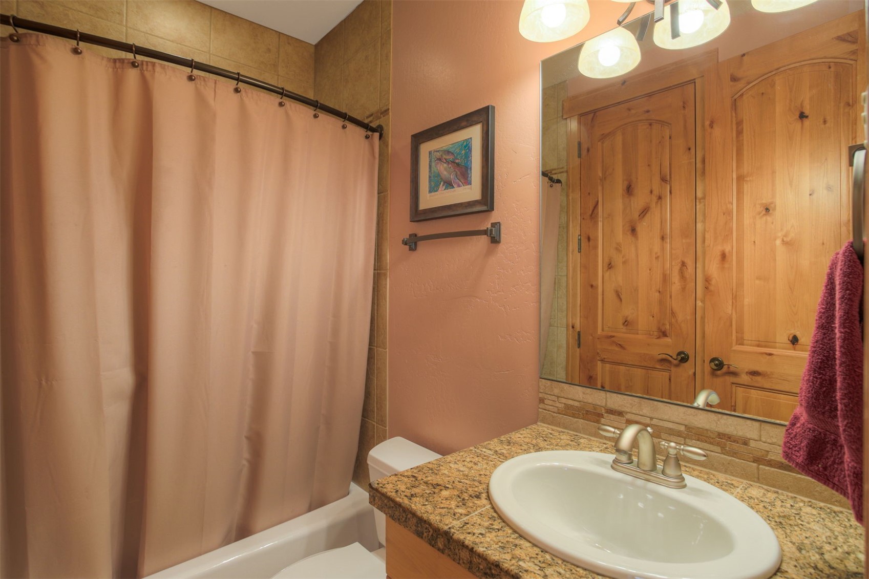 727 Willowbrook Road Silverthorne, CO 80498 - Photo 30 of 47 Full bathroom featuring vanity, shower / bath combination with curtain, and a textured wall