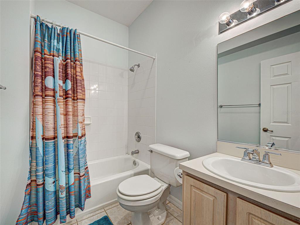1801 Highland Road Osprey, FL 34229 - Photo 28 of 40 a bathroom with a sink toilet and shower