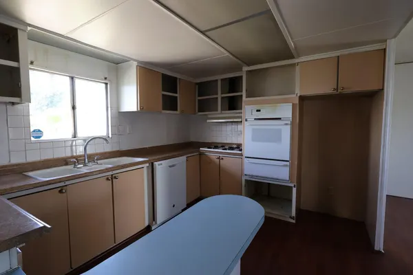 a utility room with a sink a washer and dryer