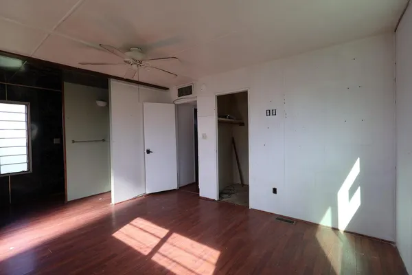 a view of a livingroom with wooden floor
