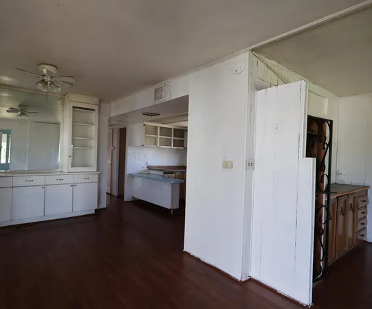 a kitchen with a refrigerator and a sink