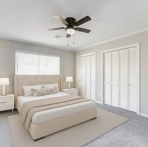 a bedroom with bed and window