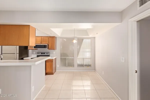a view of a kitchen with a sink dishwasher and a microwave