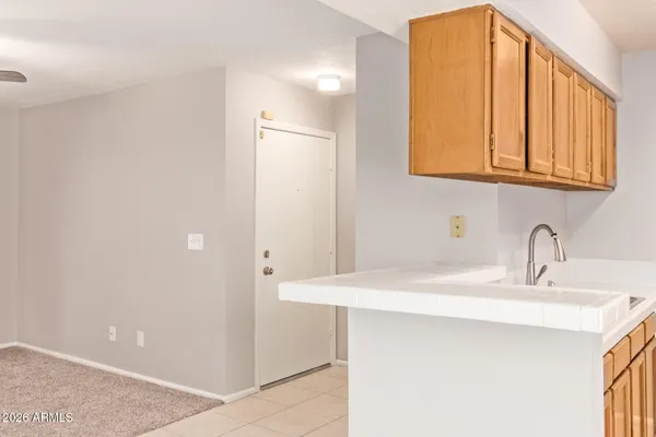 a kitchen with stainless steel appliances a stove a microwave a sink and cabinets
