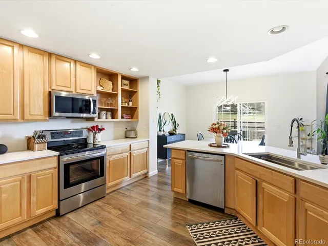 a kitchen with a refrigerator stove and microwave