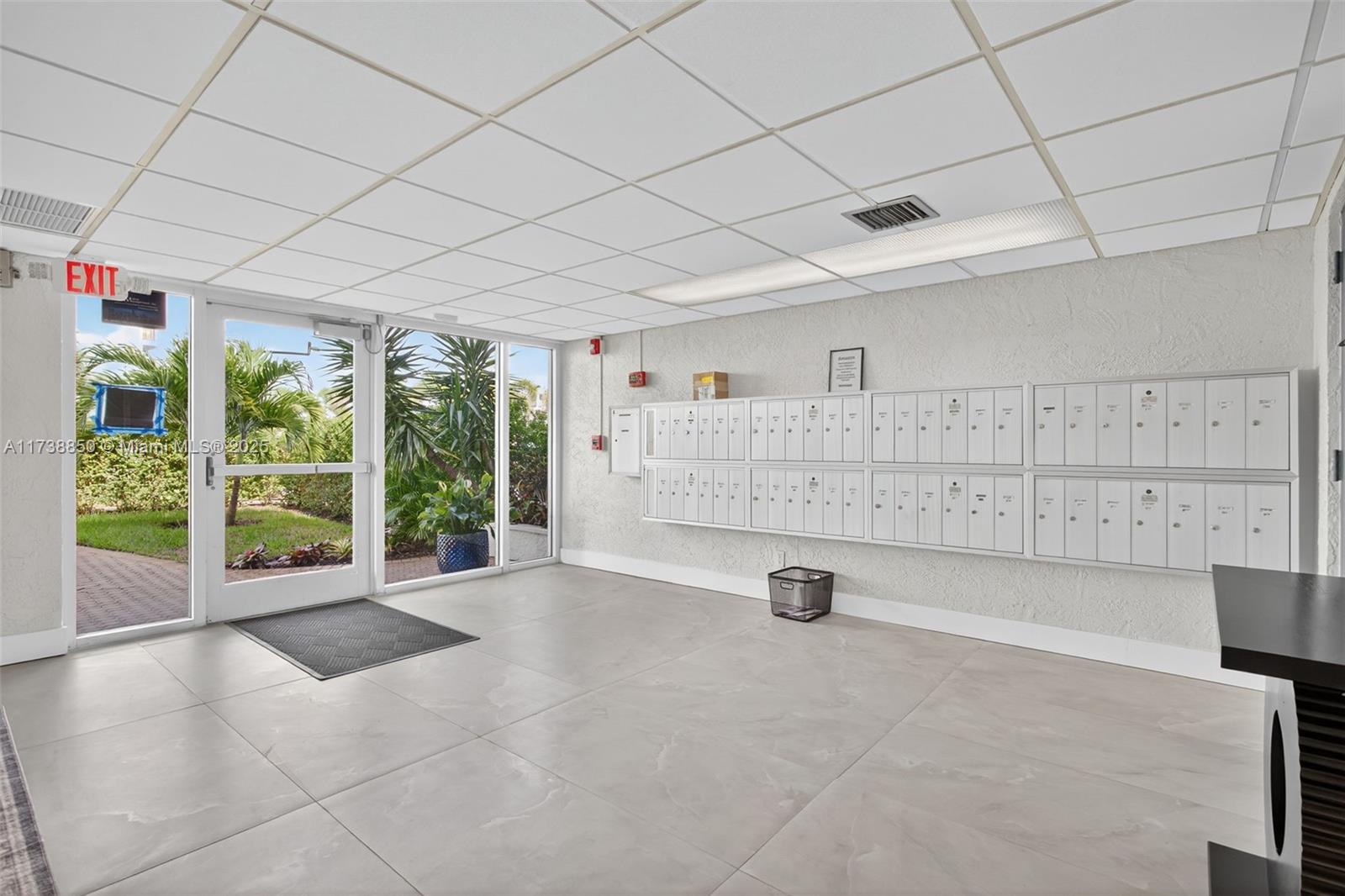 3004 Northeast 5th Terrace, Unit 214C Wilton Manors, FL 33334 - Photo 12 of 99 a view of an empty room with a iron gate