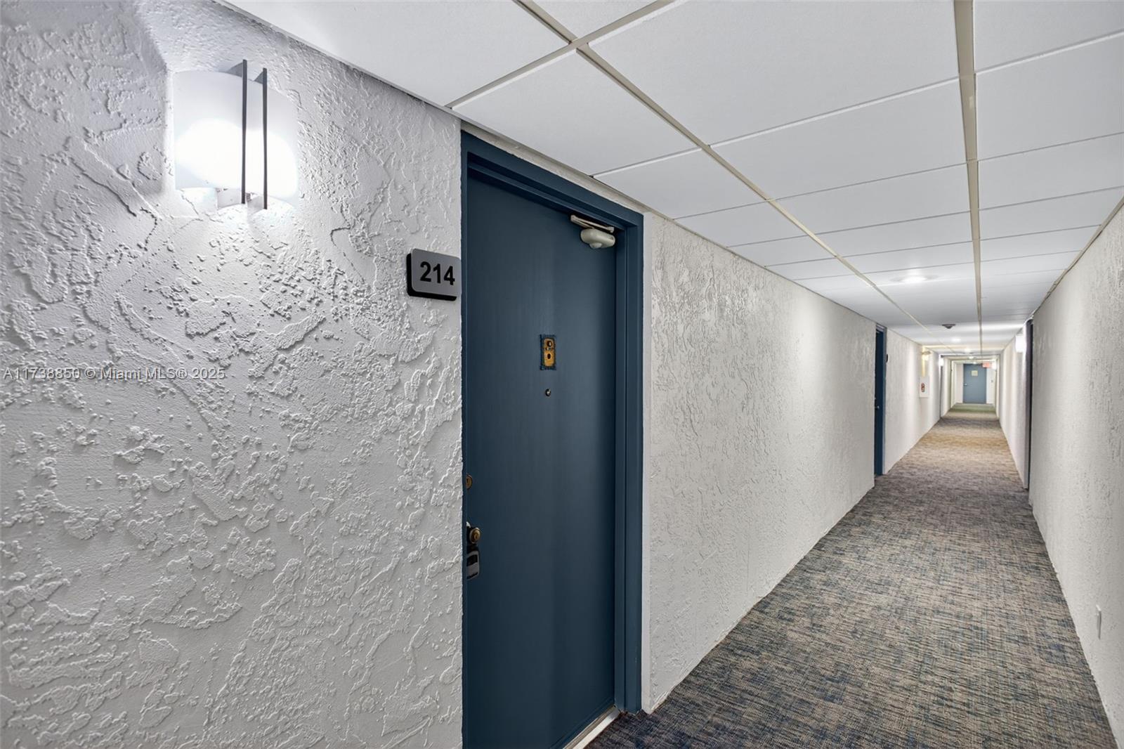 3004 Northeast 5th Terrace, Unit 214C Wilton Manors, FL 33334 - Photo 14 of 99 a view of a hallway