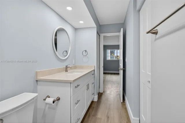 a view of a brick house with a floor to ceiling window stairs and wooden floor