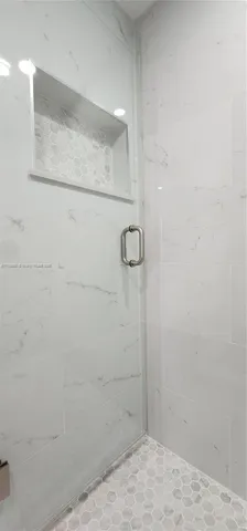 a view of a house with a tree in a yard