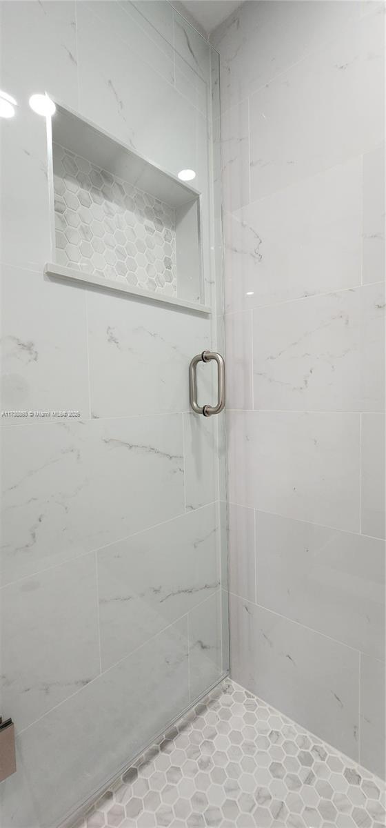 3004 Northeast 5th Terrace, Unit 214C Wilton Manors, FL 33334 - Photo 34 of 99 a bathroom with a shower