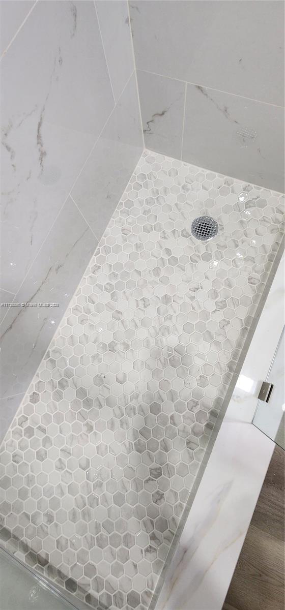 3004 Northeast 5th Terrace, Unit 214C Wilton Manors, FL 33334 - Photo 35 of 99 a view of wooden floor in a bathroom