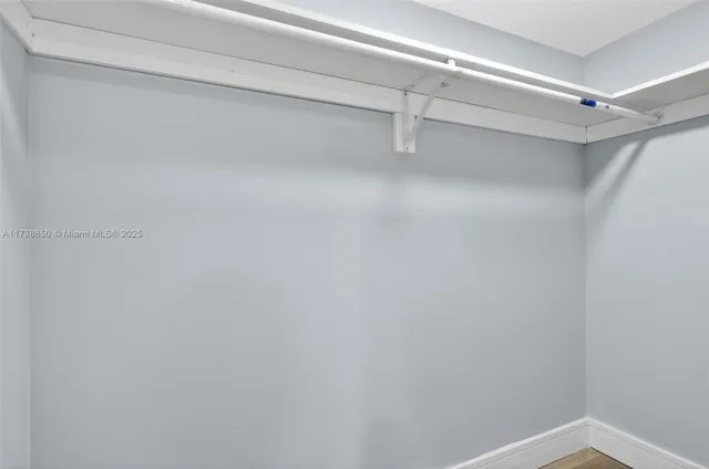 a kitchen with a table and chairs in it