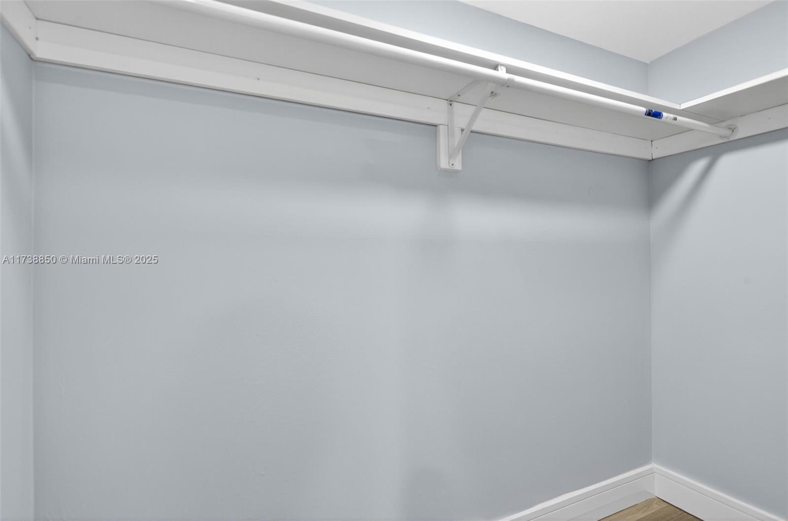 3004 Northeast 5th Terrace, Unit 214C Wilton Manors, FL 33334 - Photo 38 of 99 a view of a room with racks on the wall