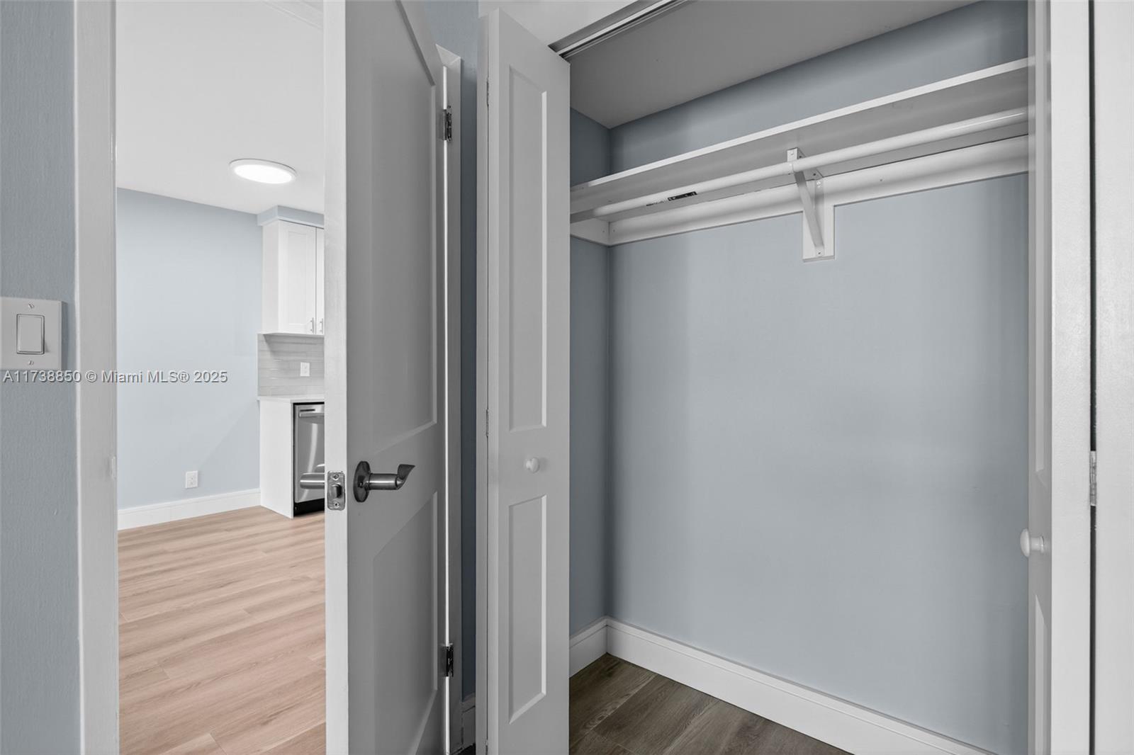 3004 Northeast 5th Terrace, Unit 214C Wilton Manors, FL 33334 - Photo 41 of 99 a view of a hallway with a wooden floor