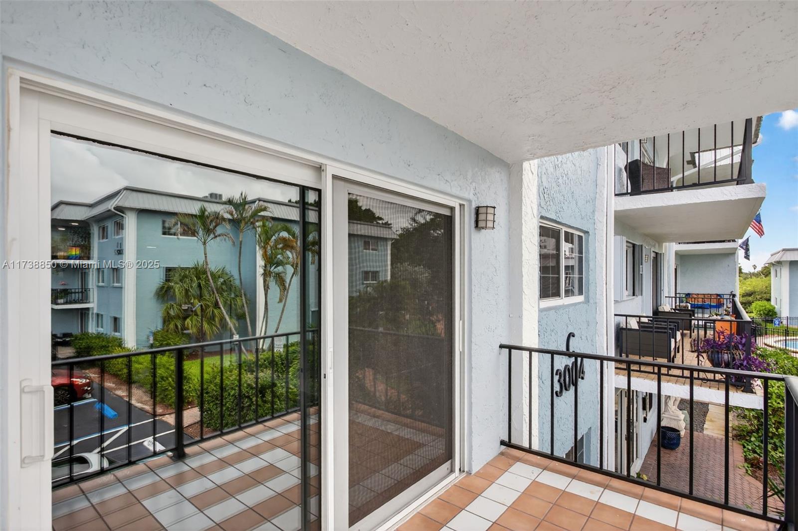 3004 Northeast 5th Terrace, Unit 214C Wilton Manors, FL 33334 - Photo 44 of 99 a view of a living room and balcony