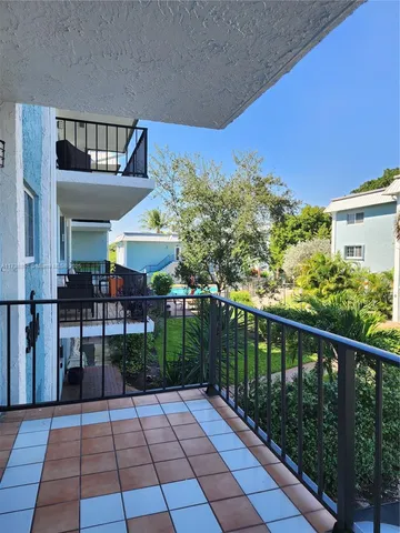 a view of a lake with houses in the back