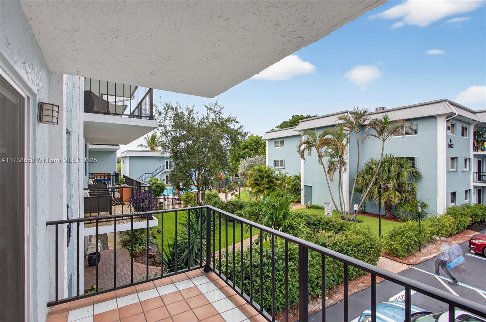 3004 Northeast 5th Terrace, Unit 214C Wilton Manors, FL 33334 - Photo 46 of 99 a view of a house with large windows and plants