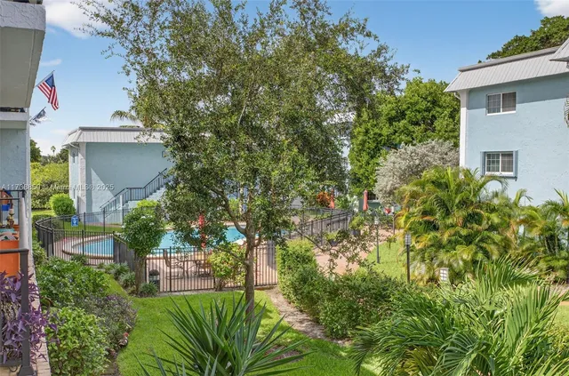 a view of a lake with a table and chairs