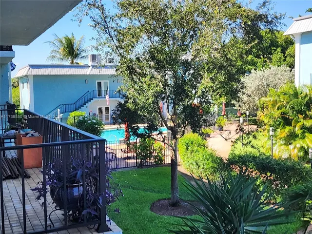 a view of swimming pool with outdoor seating