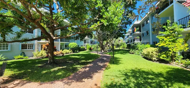a view of a lake with a yard