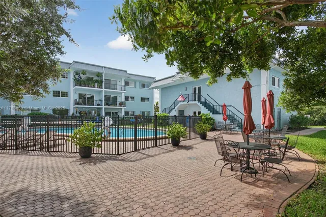 an aerial view of a houses with a yard