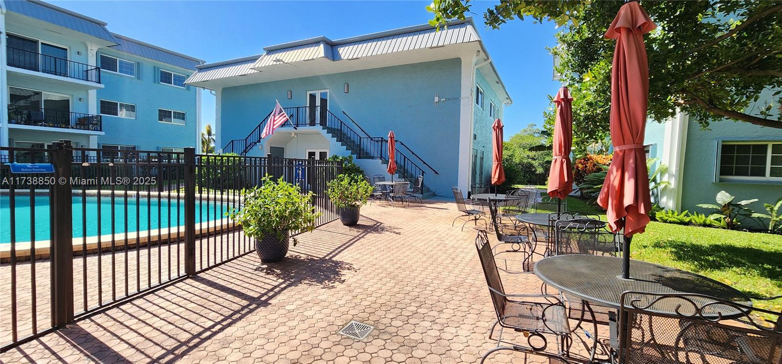 3004 Northeast 5th Terrace, Unit 214C Wilton Manors, FL 33334 - Photo 61 of 99 a view of a house with backyard and sitting area