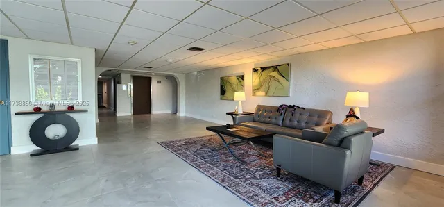 a view of an empty room with a iron gate