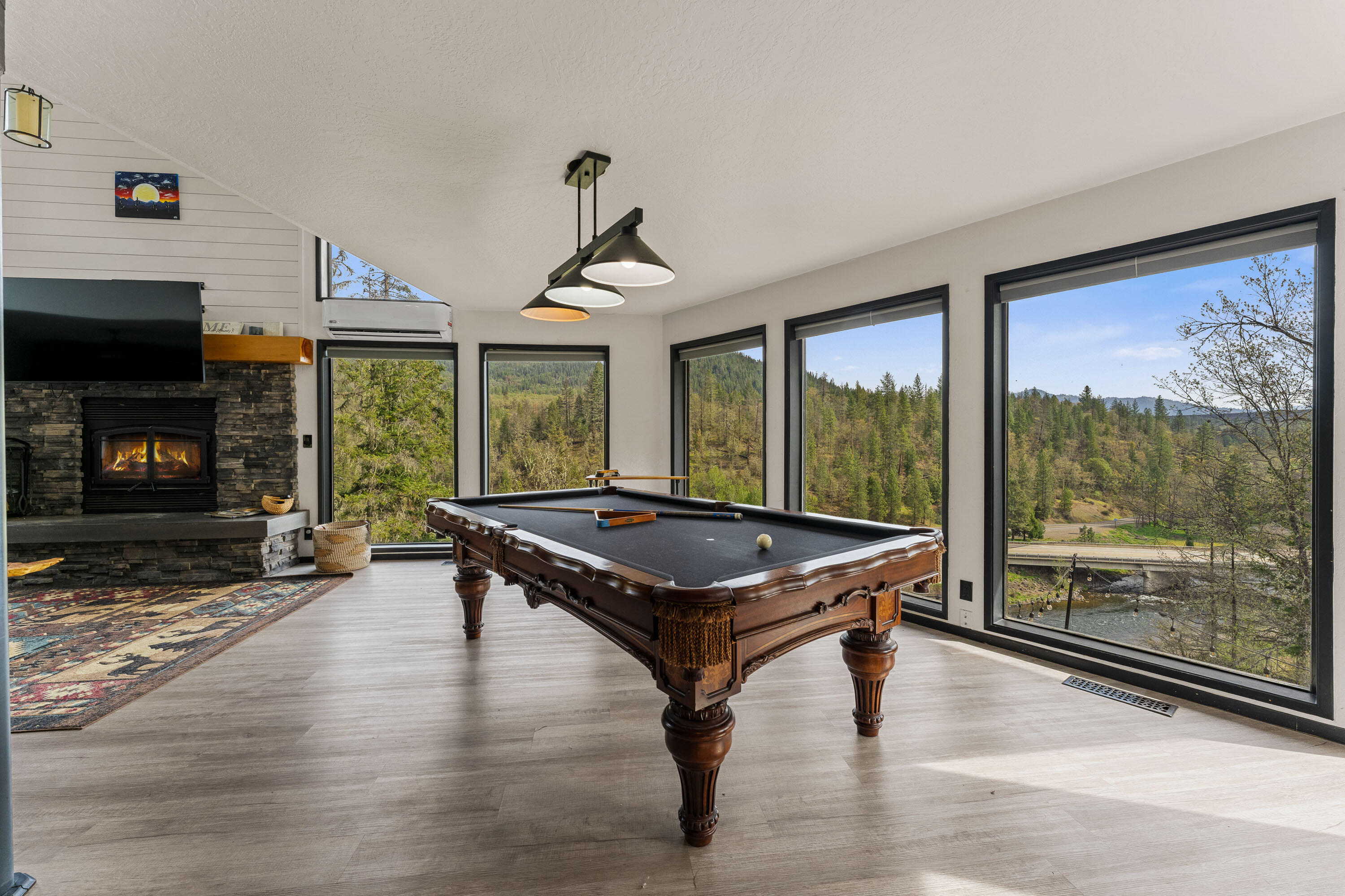 7201 Crowfoot Road Trail, OR 97541 - Photo 11 of 56 a living room with pool table and a fireplace