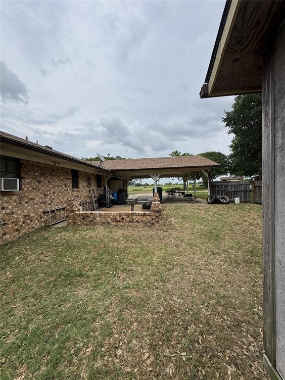 636 East Kempner Street Mabank, TX 75147 - Photo 8 of 28 Expansive covered patio structure with a shingle roof and open-air design