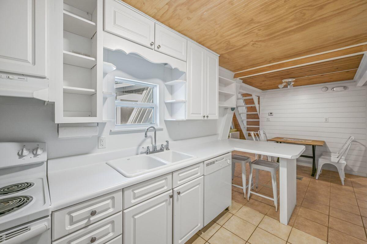 70 Dogwood Street Santa Rosa Beach, FL 32459 - Photo 6 of 15 a kitchen with a sink cabinets and appliances
