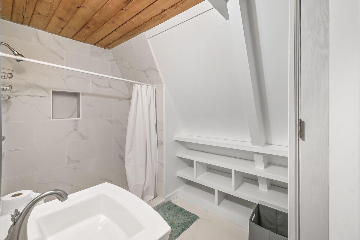 70 Dogwood Street Santa Rosa Beach, FL 32459 - Photo 7 of 15 a bathroom with a sink and a mirror