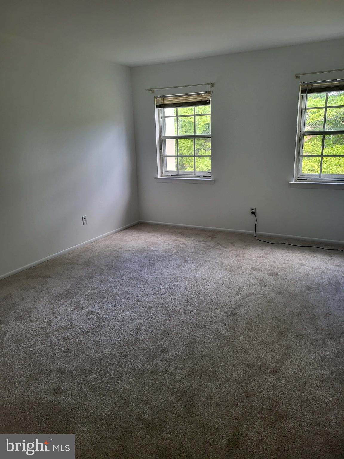 339 Old Forge Crossing, Unit 339 Devon, PA 19333 - Photo 5 of 6 an empty room with windows