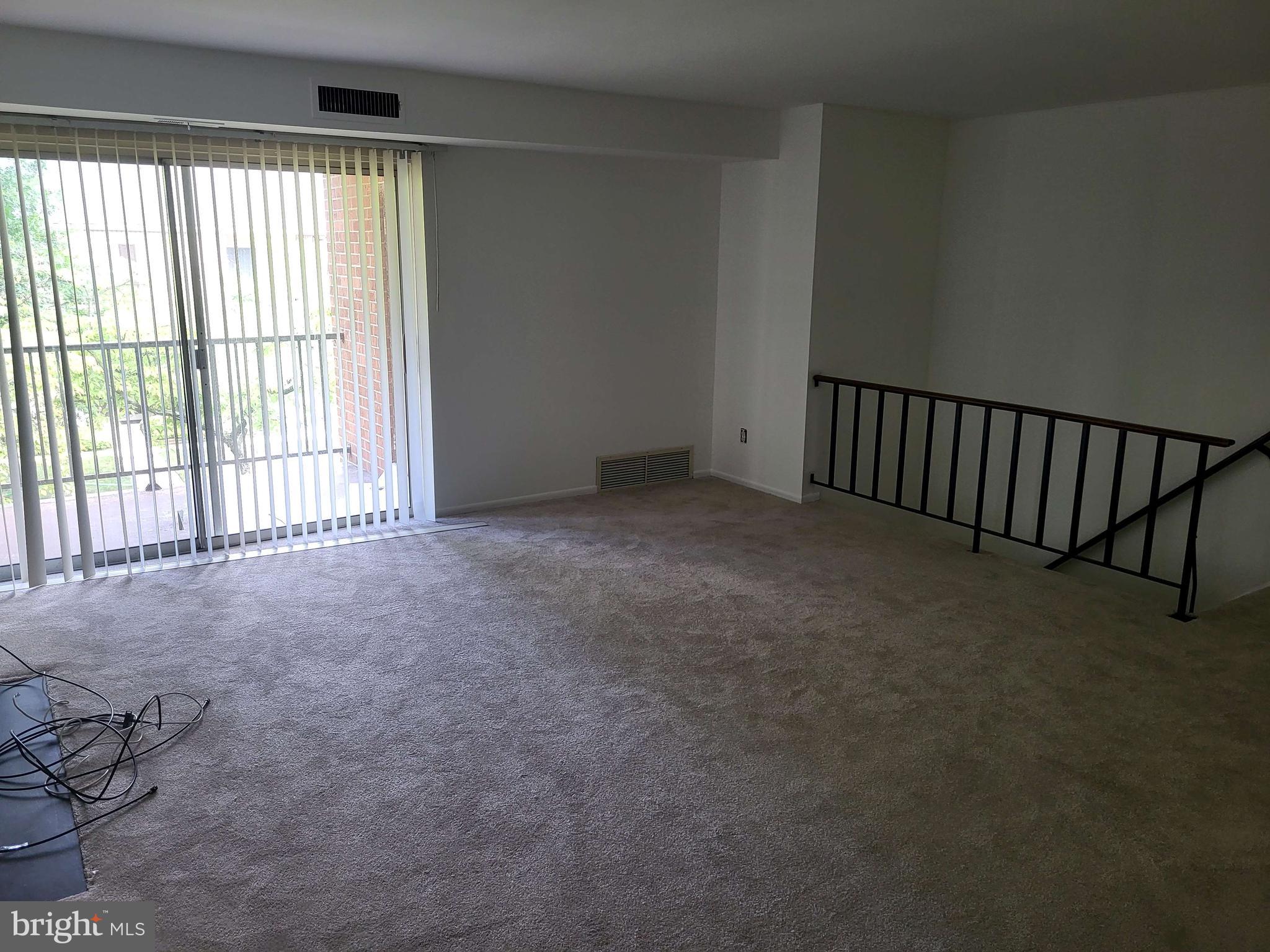 339 Old Forge Crossing, Unit 339 Devon, PA 19333 - Photo 6 of 6 a view of an empty room with a window