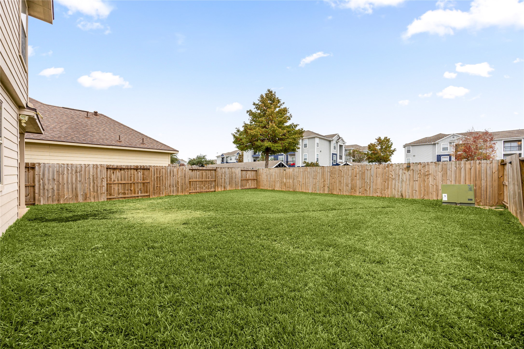 3526 Canvasback Lane Houston, TX 77047 - Photo 21 of 22 The spacious, fully fenced backyard offers plenty of open green space, providing endless opportunities for outdoor activities, play, or future customization.