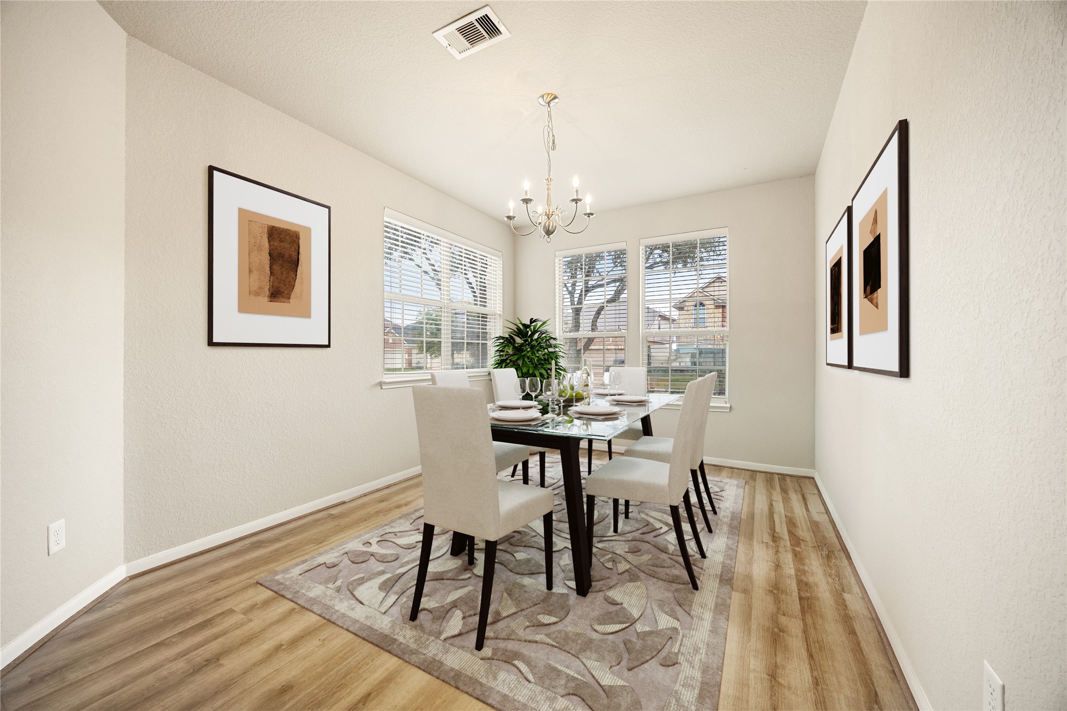3526 Canvasback Lane Houston, TX 77047 - Photo 5 of 22 The formal dining room offers an elegant space for gatherings, featuring a modern chandelier, neutral paint tones, wood-look flooring, and large windows with blinds that fill the room with natural light. The clean lines and open feel make it an ideal setting for hosting family dinners or entertaining guests. *Virtually Staged