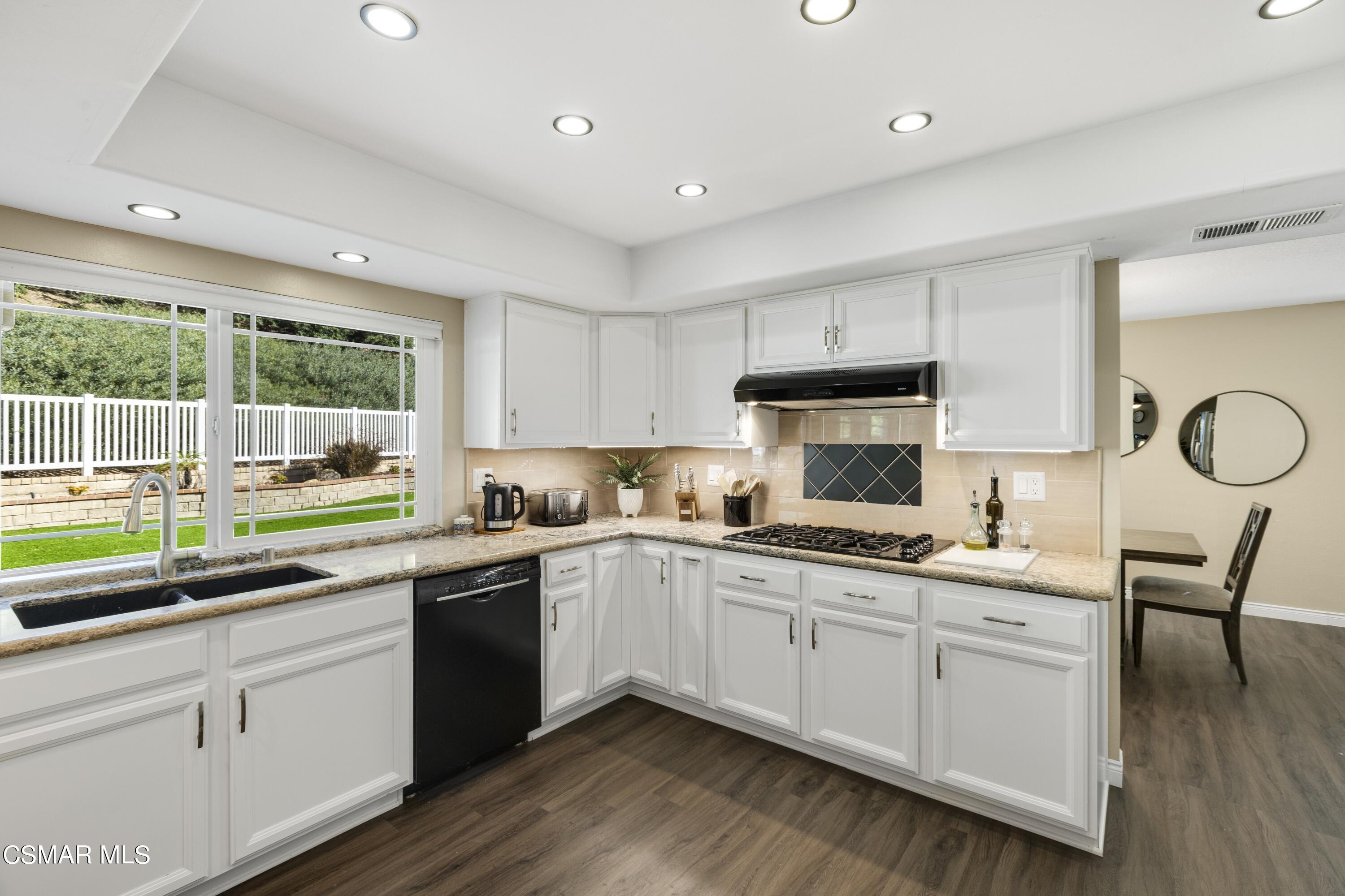 2992 Chippewa Avenue Simi Valley, CA 93063 - Photo 20 of 35 a kitchen with a sink cabinets and window
