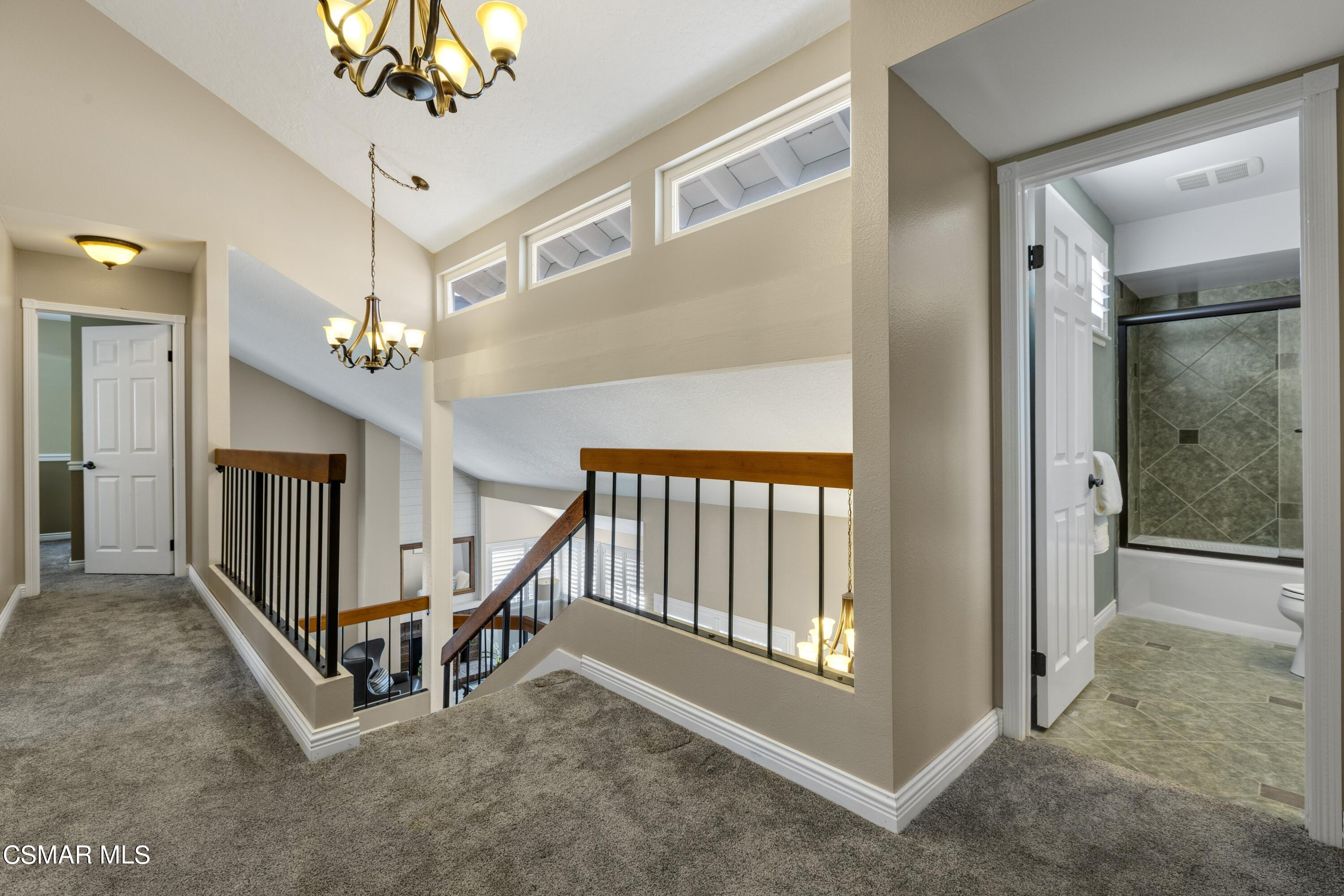 2992 Chippewa Avenue Simi Valley, CA 93063 - Photo 24 of 35 en view interior of a house with stairs and a chandelier fan