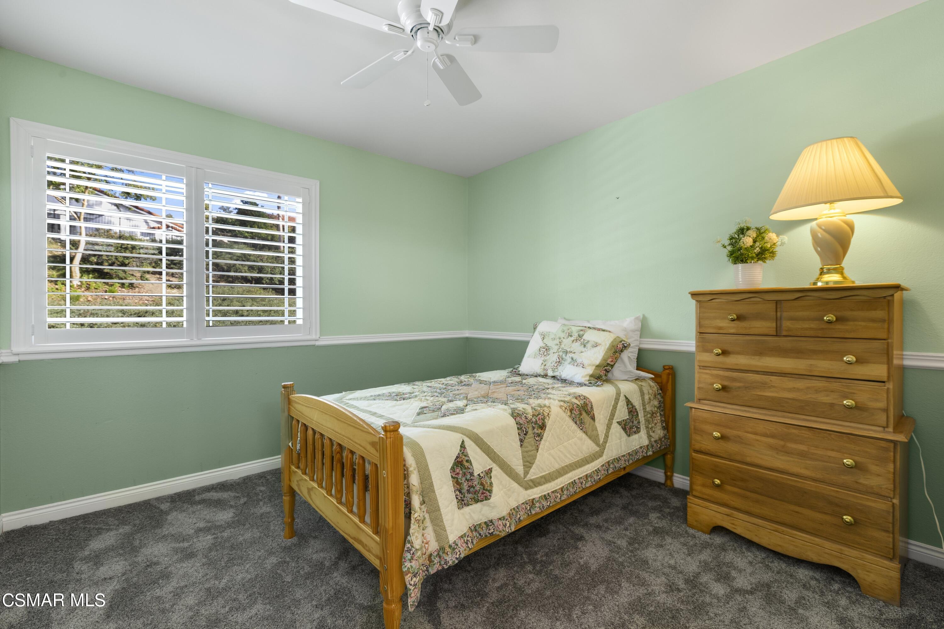 2992 Chippewa Avenue Simi Valley, CA 93063 - Photo 31 of 35 a bedroom with a bed and a window