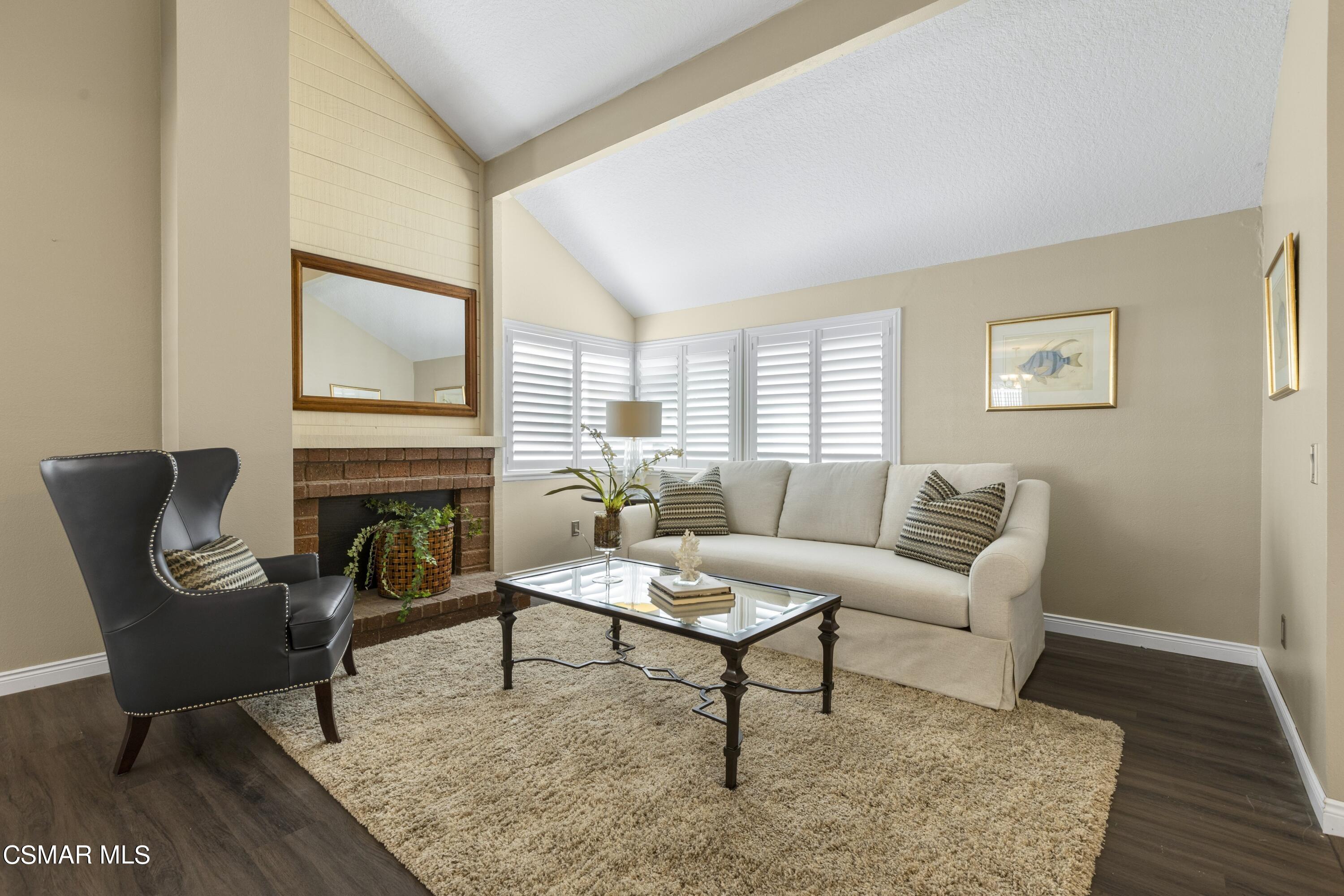 2992 Chippewa Avenue Simi Valley, CA 93063 - Photo 7 of 35 a living room with furniture and a fireplace