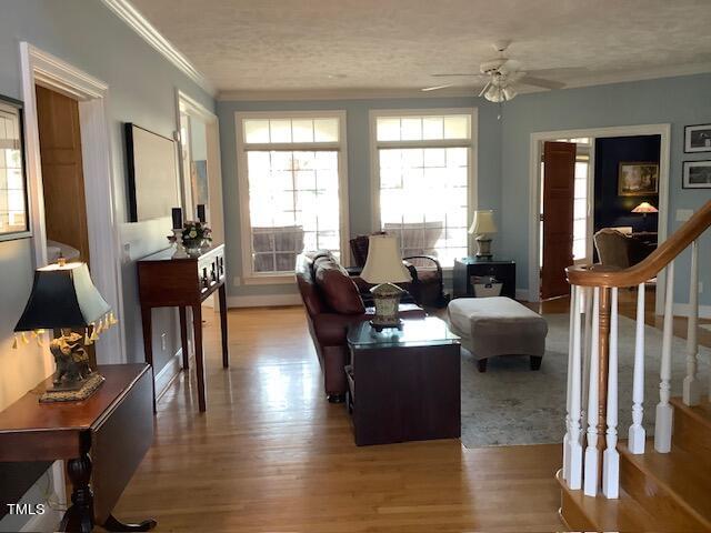 2125 Keith Hills Road Lillington, NC 27546 - Photo 7 of 66 a living room with fireplace furniture and a wooden floor