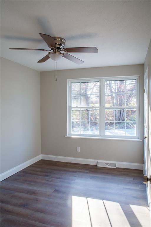 1070 Chapel Road Monaca, PA 15061 - Photo 12 of 24 a view of an empty room with wooden floor and a window