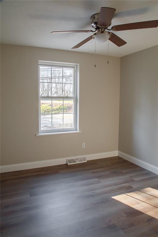 1070 Chapel Road Monaca, PA 15061 - Photo 13 of 24 wooden floor in an empty room with a window