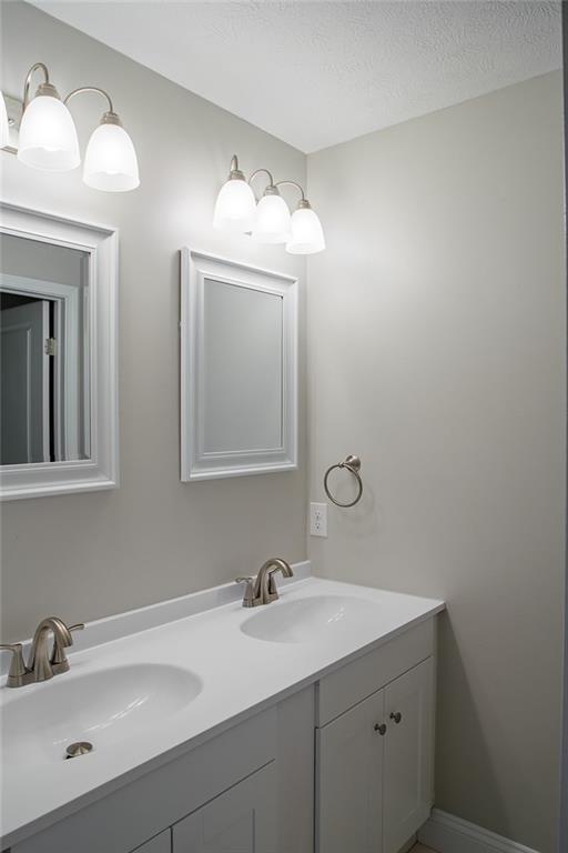 1070 Chapel Road Monaca, PA 15061 - Photo 14 of 24 a bathroom with a sink and a mirror
