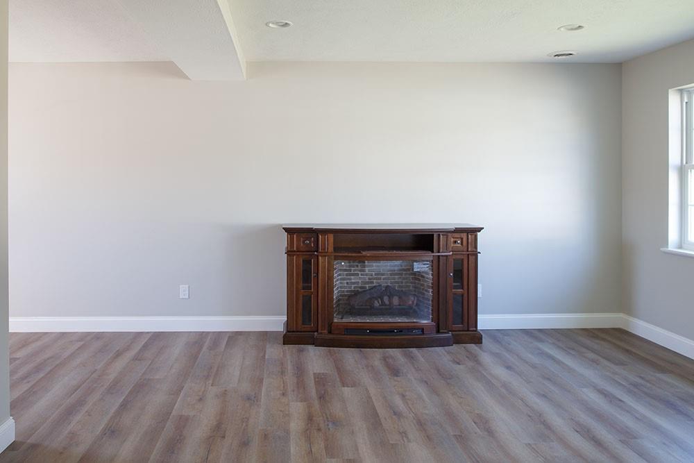 1070 Chapel Road Monaca, PA 15061 - Photo 16 of 24 a view of an empty room with wooden floor and a window
