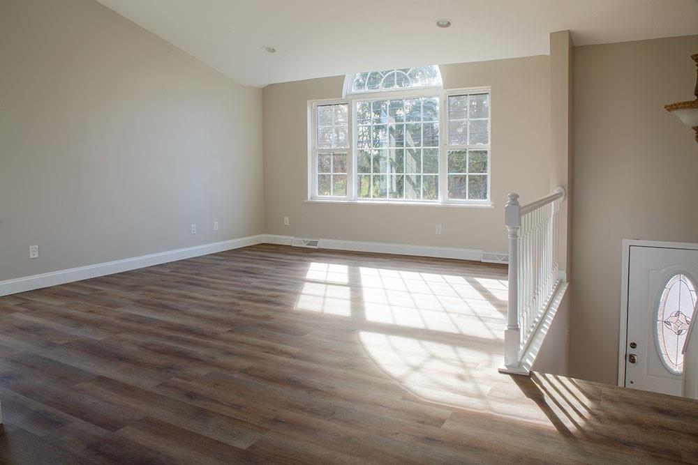 1070 Chapel Road Monaca, PA 15061 - Photo 2 of 24 a view of an empty room with wooden floor and a window
