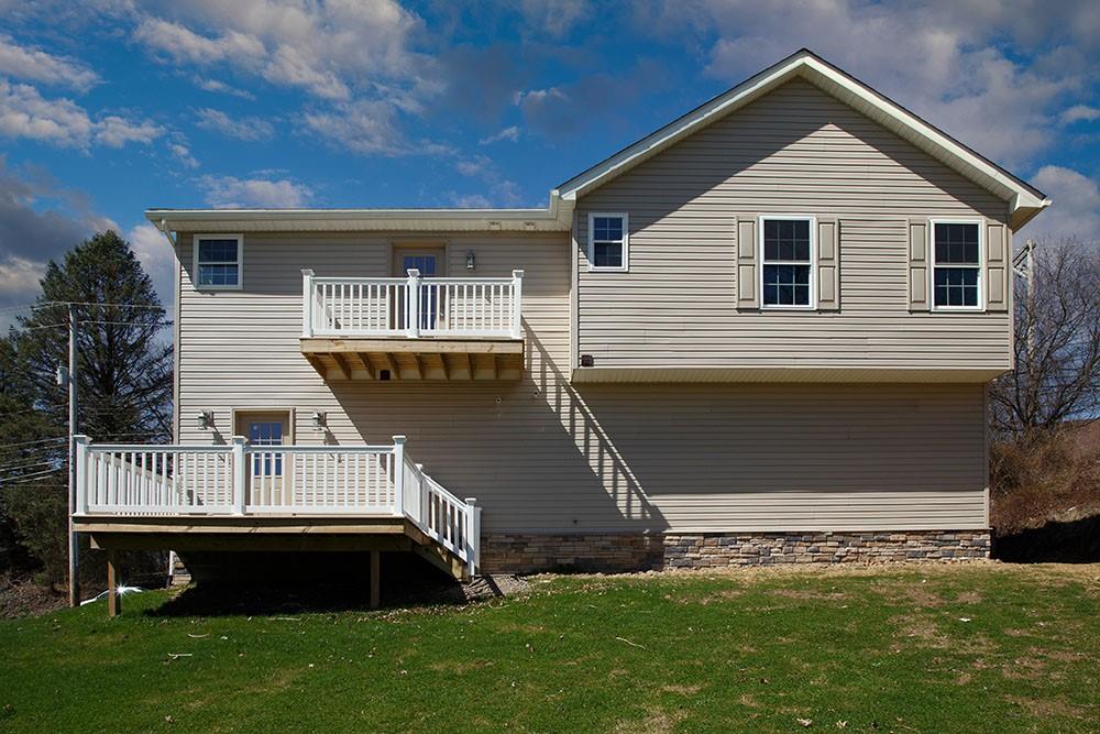 1070 Chapel Road Monaca, PA 15061 - Photo 23 of 24 a front view of a house with a garden