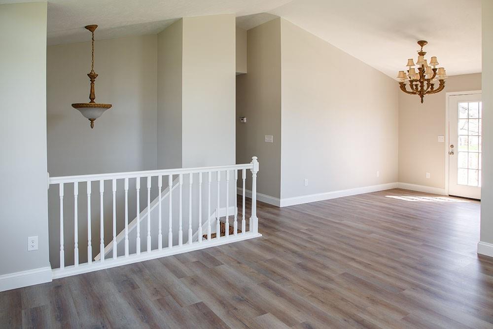 1070 Chapel Road Monaca, PA 15061 - Photo 3 of 24 a view of a hallway with wooden floor and a chandelier