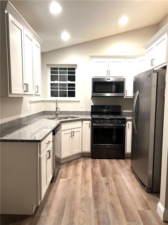 1070 Chapel Road Monaca, PA 15061 - Photo 6 of 24 a kitchen with granite countertop a stove top oven and refrigerator