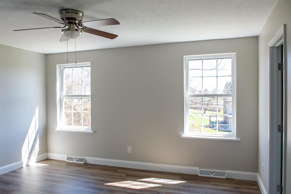 1070 Chapel Road Monaca, PA 15061 - Photo 8 of 24 a view of an empty room with window and wooden floor